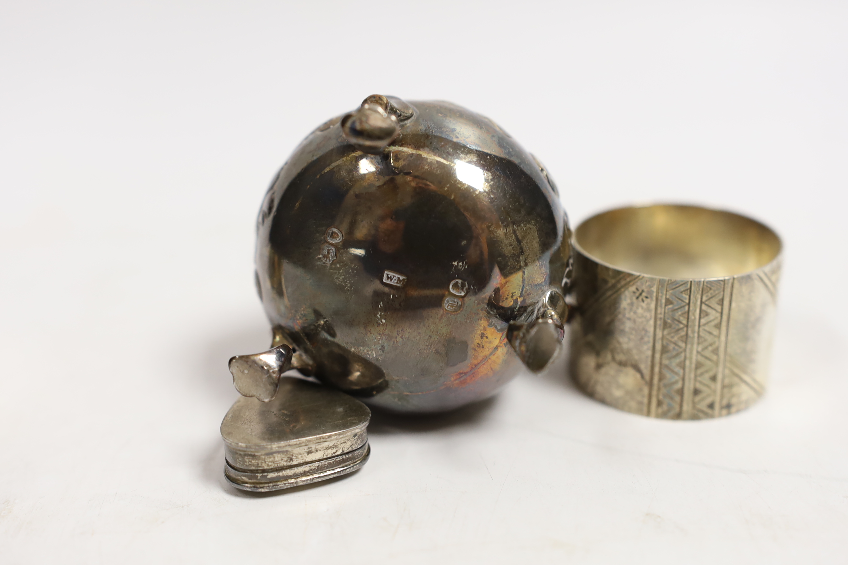 A Victorian silver baluster cream jug, London, 1846, 95mm, a pair of Victorian silver napkin rings engraved with aesthetic decoration, Charles Edwards, London, 1880 and a modern silver pill box.